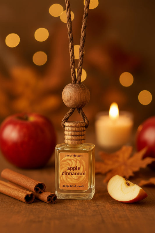 Apple cinnamon diffuser bottle with wooden elements on a warm-toned background